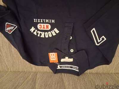 new  medium dark blue T. shirt