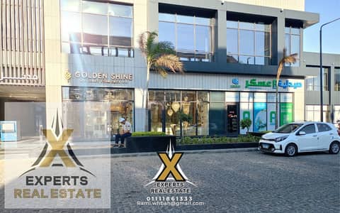 محل للبيع في مدينتي ايست هب مول دبل فيس واجهتين 65م متشطب ومتاجر بسعر قديم واوفر تجاري
