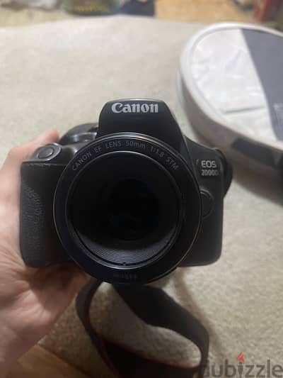 كاميرا كانون 2000d + عدسة ٥٠mm + فلاش TT560II