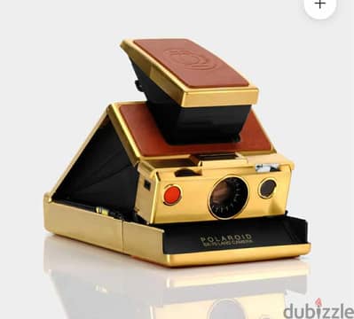 كاميرا  بولارويد SX 70 بجميع مستلزمتها