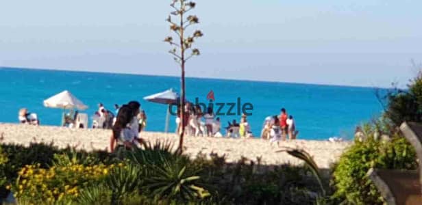 Directly on the sea, first row, 5 main bedrooms with internal bathrooms, 3 living rooms, a front garden with a terrace of 60m² on the sea, kitchen of Al-Montazah Village, North Coast, a copy of the royal palace in Al-Montazah, K79 from Alexandria, rich in its integrated services, minutes from Zahran Mall, 20 minutes from Marina Al-Alamein, and a card for entry.
