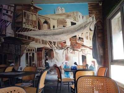 رسم جدارى لمطعم قصر الفلافل