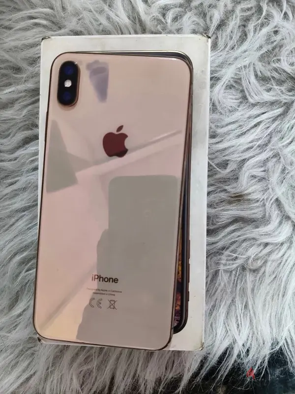iPhone XS Max dorado con caja, cargador y funda; Face ID funcional, todo funciona perfectamente