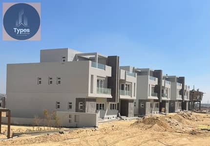 For sale, a  apartment with a garden in V Levels Dunes Compound, with a distinctive view of Sheikh Zayed. Delivery within one year at a ba