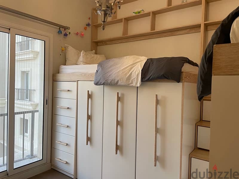 2 kids bedroom with full storage 1