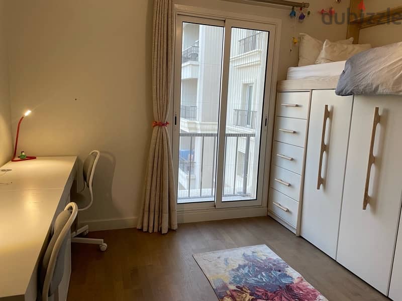 2 kids bedroom with full storage 2