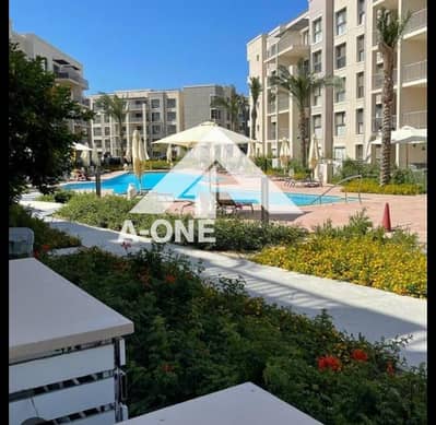 Ground floor chalet with 2 bedrooms, garden, resale, direct pool view, area 124 meters, in Marina Marassi - North Coast - Sidi Abdel Rahman