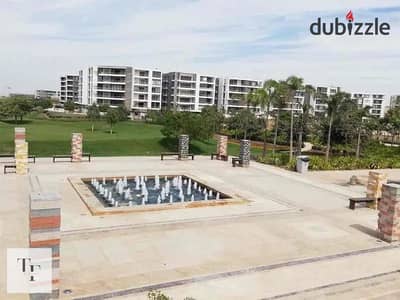 Apartment for sale in Taj City Compound, directly in front of Cairo Airport, with a 5% down payment and installments over 12 years.