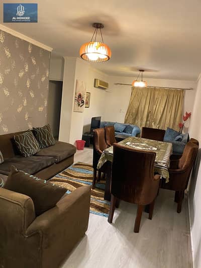 An available furnished apartment in Al-Rehab with modern furniture, covering an area of 99 square meters, overlooking a street in front of the Gateway