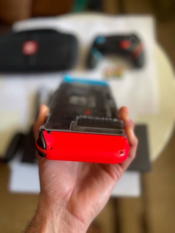 Nintendo switch + 1 extra controller + 2 games 3
