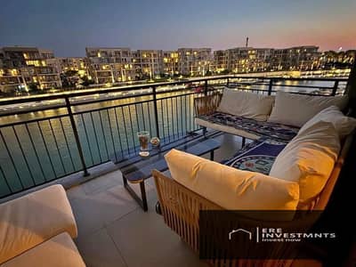 Receive immediately a fully finished two-bedroom chalet for sale below market price with an open view in Marassi (Marina West) - North Coast