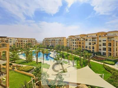 Apartment for sale ready to move in Stone Residence compound with a 25% cash discount in Fifth Settlement with a landscape view in new Cairo