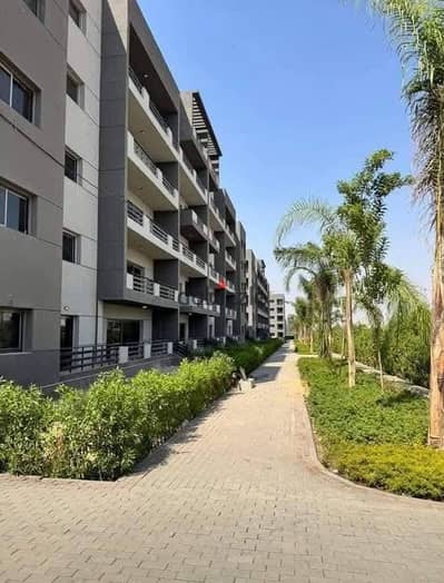 A finished 3-bedroom apartment with a landscape view for sale in Heliopolis, in front of Cairo Airport and Wadi Degla Club, in the Stoda compound.