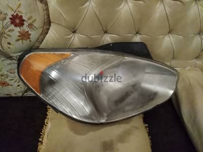 فانوس هيونداي نيو اكسنت  2010 يمين امامي اصلي ودن علويه مكسوره