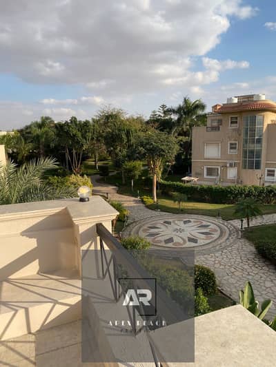 Villa for rent, semi-furnished with kitchen and air conditioning, special finishes in the Flowers Park compound, directly in front of Al-Rehab - First Settlement - New Cairo