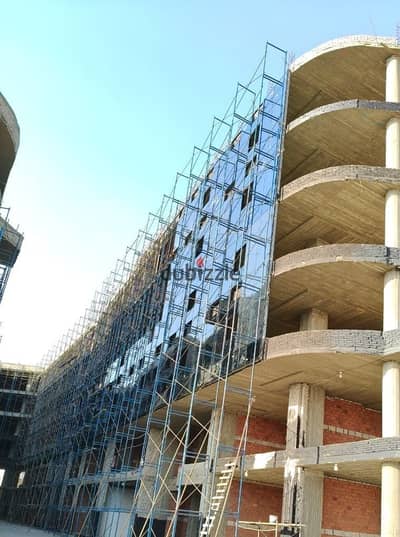 Shop for sale, installments remaining, Sheikh Zayed - 101 Mall, next to Downtown Mall, 75 sq m net