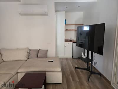Fully furnished studio apartment for rent in October Plaza Compound – SODIC. The studio area is 26 square meters plus an open roof terrace of 90 squar
