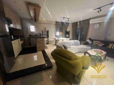 شقه للايجار المفروش تاني نمرة من شارع النوادي في اللوتس الجنوبيه ارضي بجاردن