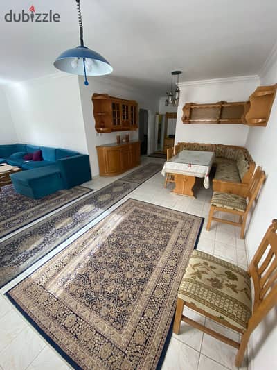 Fully furnished apartment for rent with garden views from all directions, second floor, elevator, 3 rooms, ready to move in, in Al Rehab 1 - Phase 1