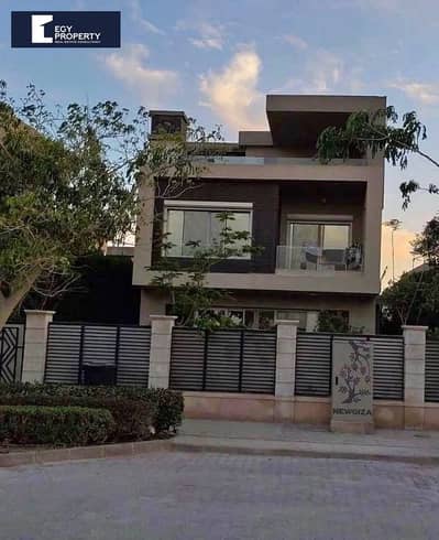 With Special Price and a Prime View Large Villa for Sale in New Giza - 6th of October City