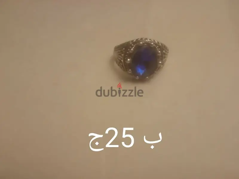 Ring with a deep royal blue stone, oval-cut, beautifully reflecting light.