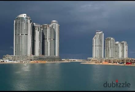 للبيع شقه تشطيب فندقي استلام فوري ع الفرش في الابراج  العلمين   تابعه لوزاره الإسكان دبل فيو ع اللاجون و البحر مباشرة بالتقسيط علي 12 سنه