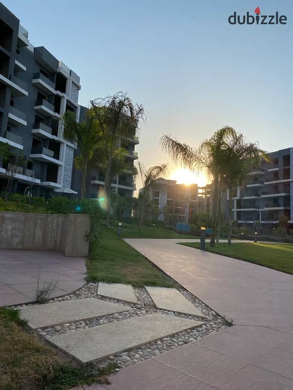 Ready for viewing Ground floor apartment with garden immediate delivery in Sun Capital located in the New Administrative Capital area with a landscape