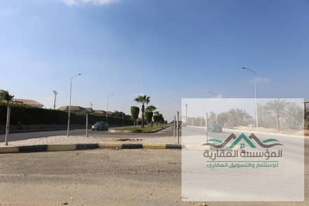 Land for sale on 3 streets steps from Al-Nazihah Street in Sheikh Zayed - Alexandria Desert Road - Smart Village - Hyper One - July 26 Axis