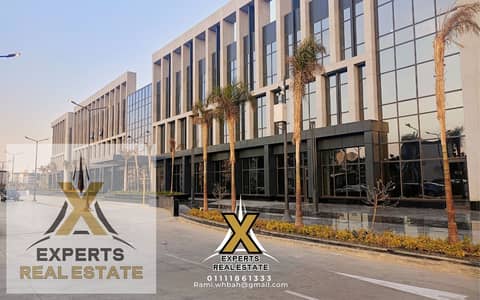 Office for sale in Madinaty East Hub, finished VIP, and shops for 120 thousand at a bargain price. Office for sale in East Hub, the administrative building with a panoramic facade above the bank.