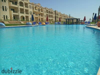 Panoramic sea & pool view chalet, fully finished with furniture, for sale with installments in a premium resort in Ain Sokhna.