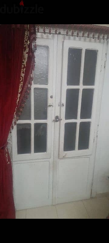 درفتين باب بلكونه بالسلك بتاعهم و الحلق