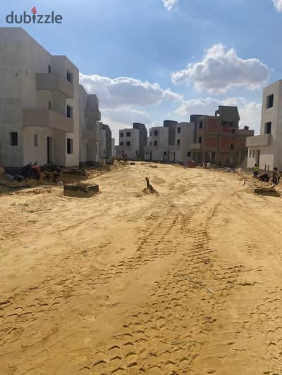 Fully finished duplex with a garden for sale in Rivers Compound, directly on Dabaa Axis, just minutes from the Cairo–Alexandria Desert Road.