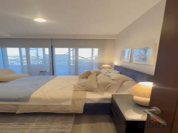 Own and invest in a 57-meter finished studio with air conditioning in Zed Towers Sheikh Zayed at a very special price