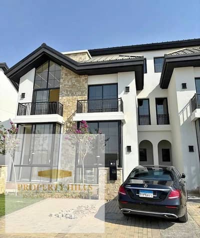 A detached villa for sale in Mostakbal City with a lake view. The villa has a spacious garden and consists of 3 floors.
