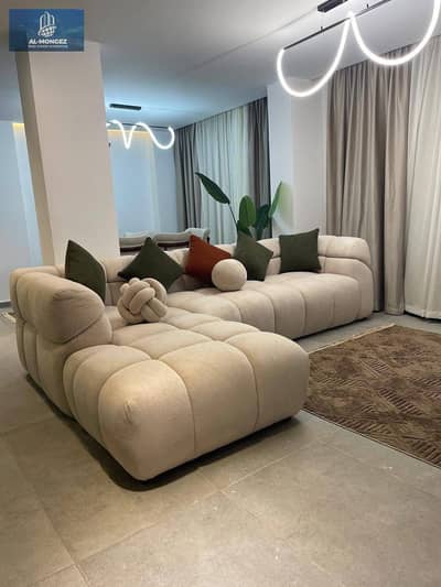 A furnished apartment is available for rent in Madinat Al Rehab, with an area of 90 square meters at a special price.