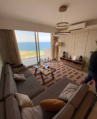 For sale A distinctive chalet with a double sea view, hotel-style finishing, and air conditioning, located in Monte Galala, Ain Sokhna