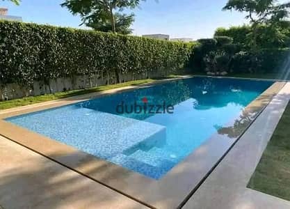 villa for sale in Zomra Compound on North 90th Street, directly wall-to-wall with Al Marasem and Palm Hills, in the heart of Golden Square