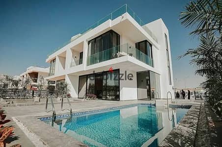 villa for sale in Zomra Compound on North 90th Street, directly wall-to-wall with Al Marasem and Palm Hills, in the heart of Golden Square