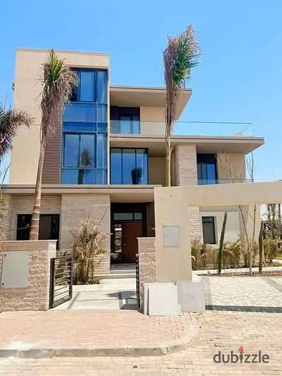 villa for sale in Zomra Compound on North 90th Street, directly wall-to-wall with Al Marasem and Palm Hills, in the heart of Golden Square