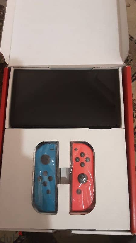 nintendo switch oled red and blue near perfect condition 2