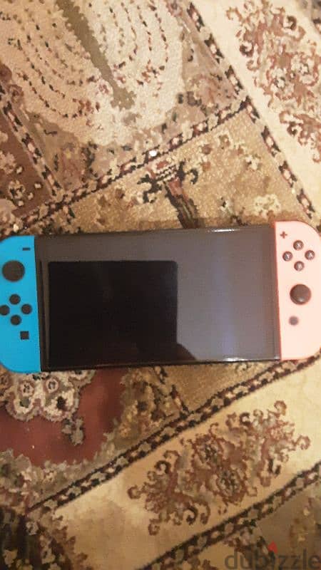 nintendo switch oled red and blue near perfect condition 3