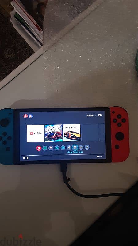 nintendo switch oled red and blue near perfect condition 10