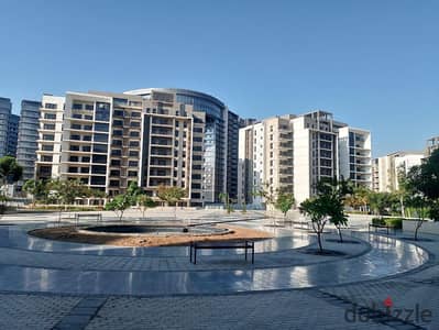 Lowest price for a resale apartment in Zed Compound Sheikh Zayed, fully finished with air conditioning, featuring a distinctive view—opposite Al Rabwa