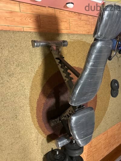 gym dumbbells and bench