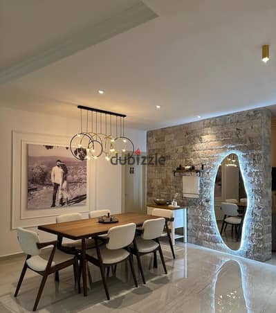 Ready-to-move-in fully finished apartment directly on the Suez Road, opposite Swan Lake Hassan Allam and Mohamed Naguib Axis, and minutes from the Ame