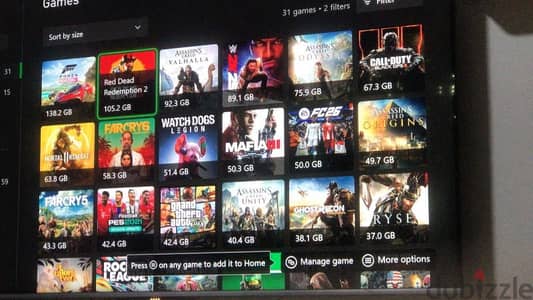 للبيع: Xbox One (Original) بكرتونته - "خزنة ألعاب" كاملة بدراعين