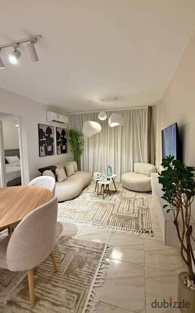 Ready to move  apartment with garden, fully finished, for sale with the best landscape view in the heart of Sheikh Zayed City – Namya Compound.