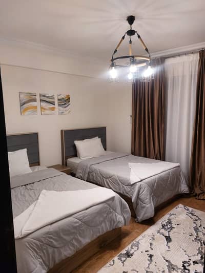 Apartment for rent in Compound Janna 1 Sheikh Zayed, fully furnished with hotel furniture and air-conditioned in a very prime location in Sheikh Zayed, 3 rooms
