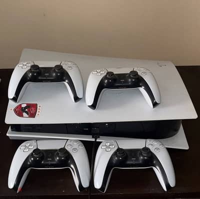 PlayStation 5 with 4 controllers