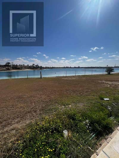 First row villa overlooking a rocky and sandy lake with a private paved beach. Prime location, stunning views. Price negotiable. A unique opportunity for sale.